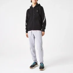 Lacoste Sweat Zippé à Capuche à Bandes Siglées 11 Lacoste Sweat Zippé à Capuche à Bandes Siglées -Mode Décontractée 984fcb63378d50976bea7144de39c06a
